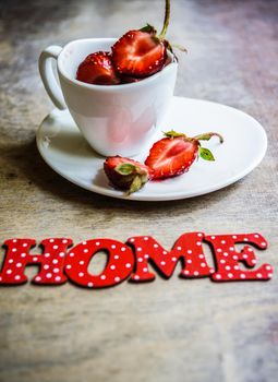 Fresh strawberries in the glasses as a dessert on rustic style table