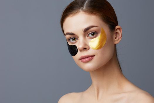 woman multicolored patches rejuvenation skin care fun isolated background. High quality photo