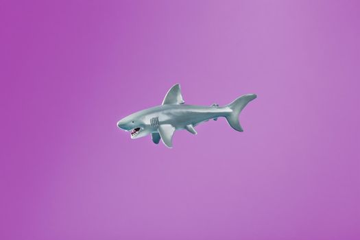 Toy animals on a pink background. Cats, sharks, dolphins, pink background.