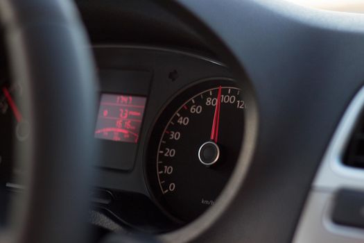 high speed on tachometer on black dashboard in automobile 