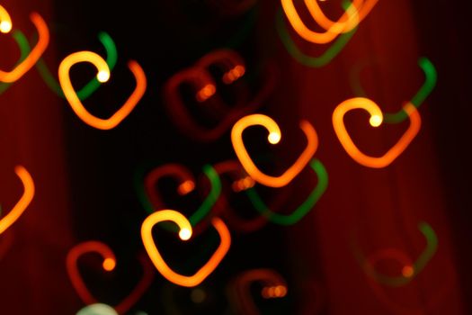 abstract heart bokeh orange lights on dark background