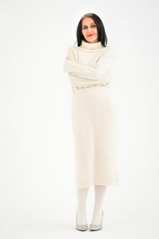 Middle aged woman starting getting grey-haired is posing in studio in sweater on white background, face skin care beauty, middle age skincare cosmetics, cosmetology concept.