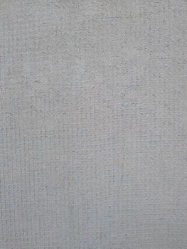 Background cement sand plaster, with blue reinforcing mesh