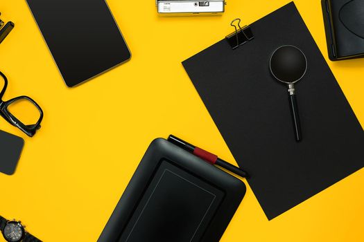 Workplace with office items and business elements on a yellow background. Concept for branding. Top view. Copy space. Still life