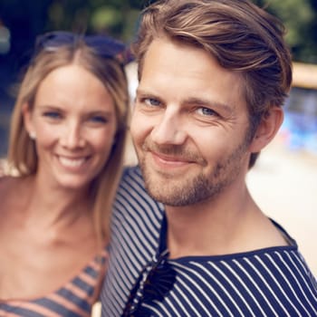 Portrait of an attractive couple standing together and smiling