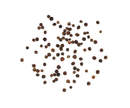 Close up separate black pepper peppercorns spilled and spread around isolated on white background, elevated top view, directly above