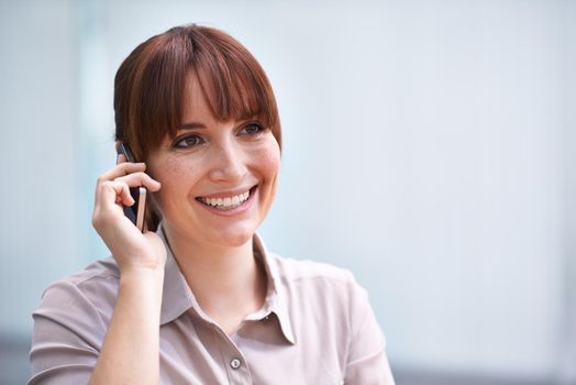 Shot of a beautiful young businesswoman talking on a cellphone