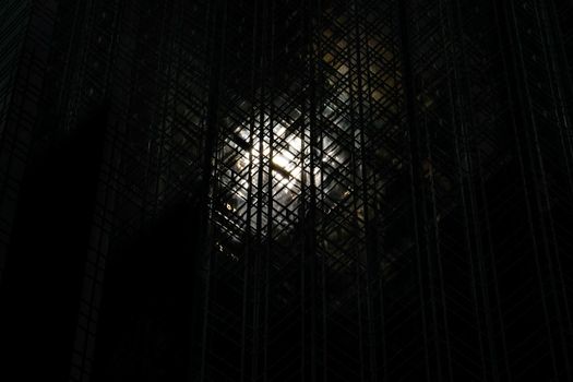 Sun (New York) reflecting on playing cards tower. Shooting Location: New York, Manhattan