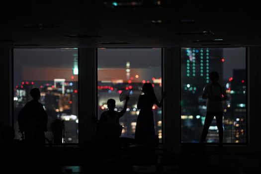 Silhouette of urban night view and people. Shooting Location: Tokyo metropolitan area
