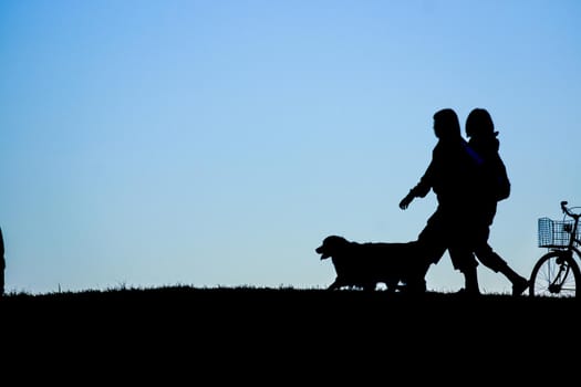 Silhouette image of people standing on the hill (wallpaper material). Shooting Location: Tokyo metropolitan area