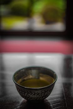 Matcha plated at the Japanese-style desk. Shooting Location: Tokyo metropolitan area
