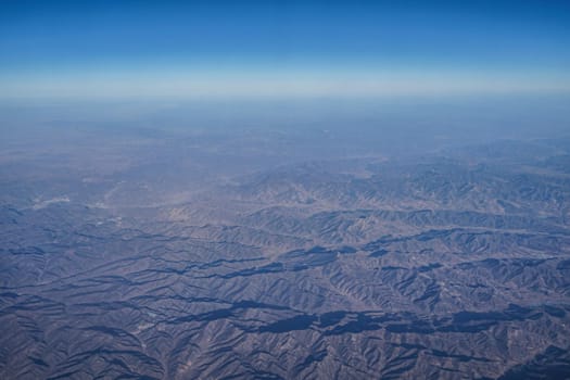 Chinese mountainous zone that can be seen from the plane. Shooting Location: China, Beijing