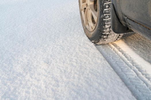 the track of a car wheel in the snow. High quality photo