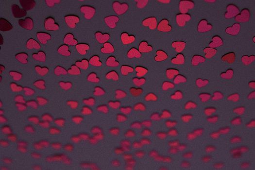 Beautiful heart confetti falling on the dark background. Invitation Template Background design, greeting cards, poster. Valentine's Day