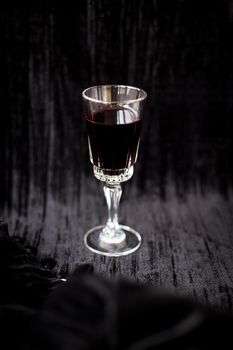 nice glass of red wine on a black background Velvet.