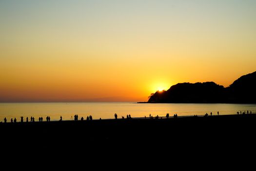 Silhouette of dusk and people on Kamakura coast. Shooting Location: Kamakura City, Kanagawa Prefecture