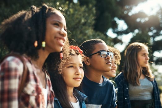 Shot of a group of teenagers having fun in nature at summer camp