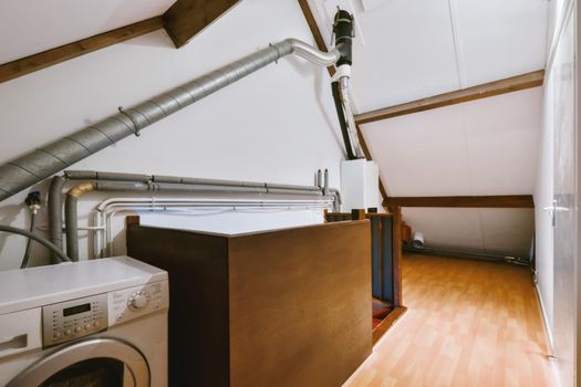 Fascinating laundry room with washing machine and stairs