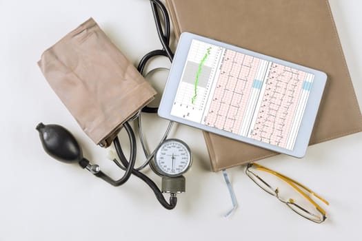 Medicall office workplace with a stethoscope cardiogram chart with medical table for heart record patient
