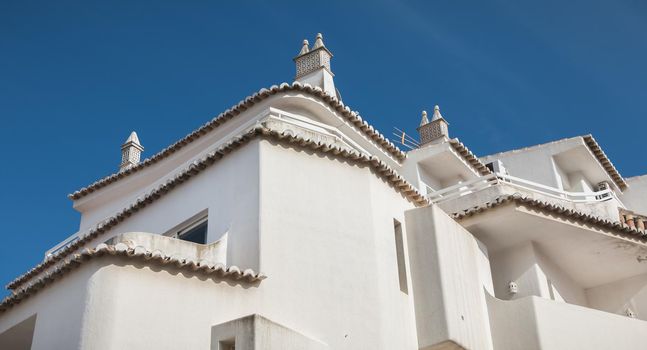 Albufeira, Portugal - May 3, 2018: architecture detail of typical houses in the historic city center on a spring sunny day