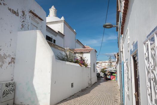 Albufeira, Portugal - May 3, 2018: architecture detail of typical houses in the historic city center on a spring sunny day