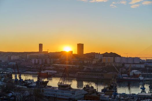 Urban landscape with a view of the Diomid port at dawn. Vladivostok, Russia