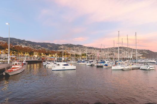 Funchal, Madeira, Portugal - December 31, 2021: View of Funchal marina where people gather in the evening to watch the new year fireworks