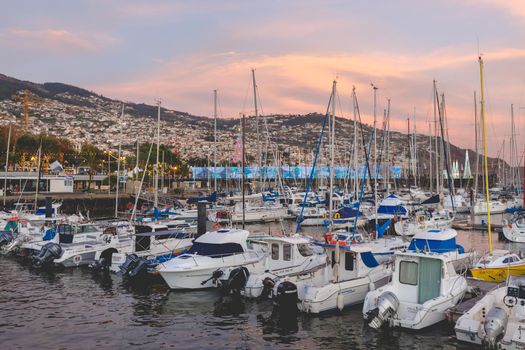 Funchal, Madeira, Portugal - December 31, 2021: View of Funchal marina where people gather in the evening to watch the new year fireworks