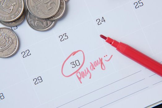 Close up of pay debt word on calendar.
