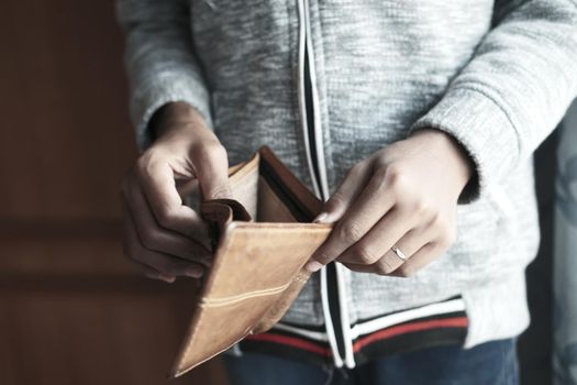 Man hand open an empty wallet with copy space