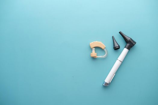 Hearing aid equipment on light green background ,