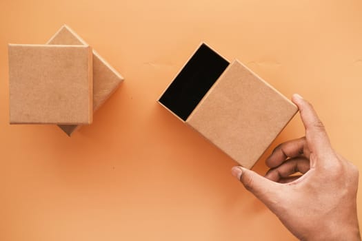 top view of person open a empty small gift box ,