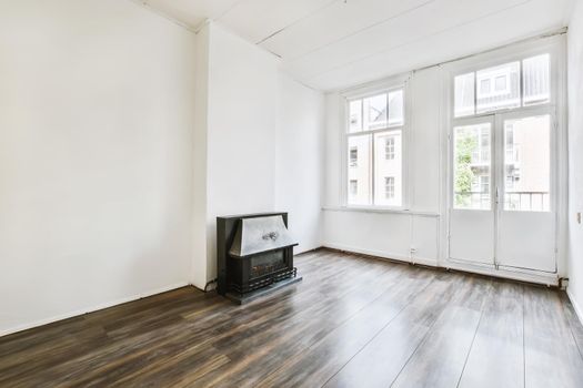 Spectacular design of the room with fireplace and parquet floor