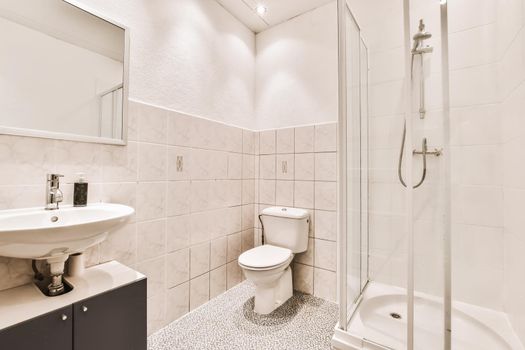 Spectacular bathroom design with beige tiled walls and toilet