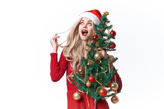 Cheerful Woman holiday toys Christmas tree decoration fun. High quality photo