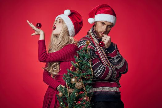 man and woman christmas holiday new year romance red background. High quality photo