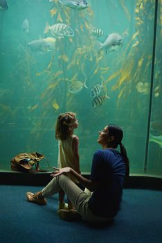 Shot of a mother and daughter on an outing to the aquarium
