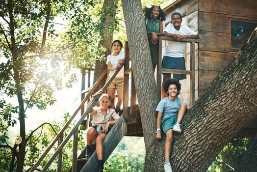 Shot of a group of teenagers standing next to a treehouse at summer camp