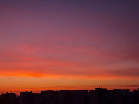 Sunset background with wonderful golden yellow sky, Amazing purple and orange sky in evening