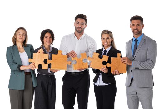 Group of business people assembling jigsaw puzzle Isolated on white background