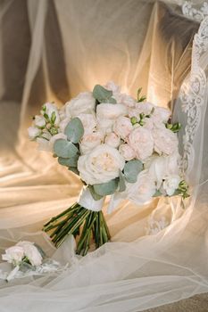 Wedding bouquet of roses lying on the surface. Wedding floristry.