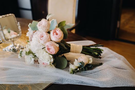 Wedding bouquet of roses lying on the surface. Wedding floristry.