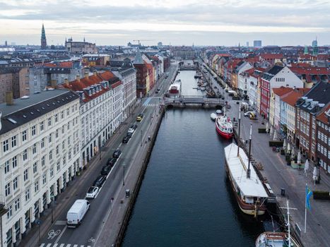 Copenhagen, Denmark - April 07, 2020: Aerial drone view of the famous Nyhavn district in the historic city centre.