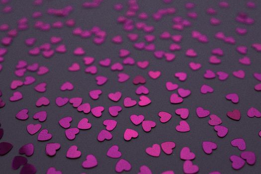 Beautiful heart confetti falling on the dark background. Invitation Template Background design, greeting cards, poster. Valentine's Day