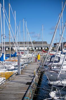 Hundested, Denmark - July 09, 2020: Sailboats anchored at the small local harbour.