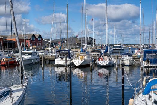 Hundested, Denmark - July 09, 2020: Sailboats anchored at the small local harbour.