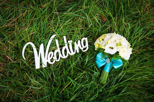 beautiful bouquet and a white wooden sign wedding