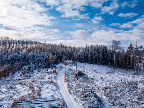 Aerial view of winter landscape covered by snow in sunny day. Czech Republic, Vysocina region highland