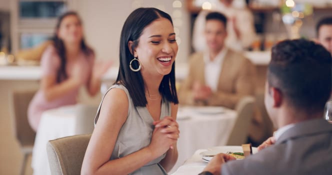 4k video footage of a man proposing to his girlfriend while on a date at a restaurant