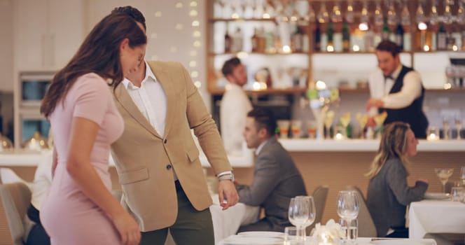 4k video footage of a man getting up to greet his date at a restaurant